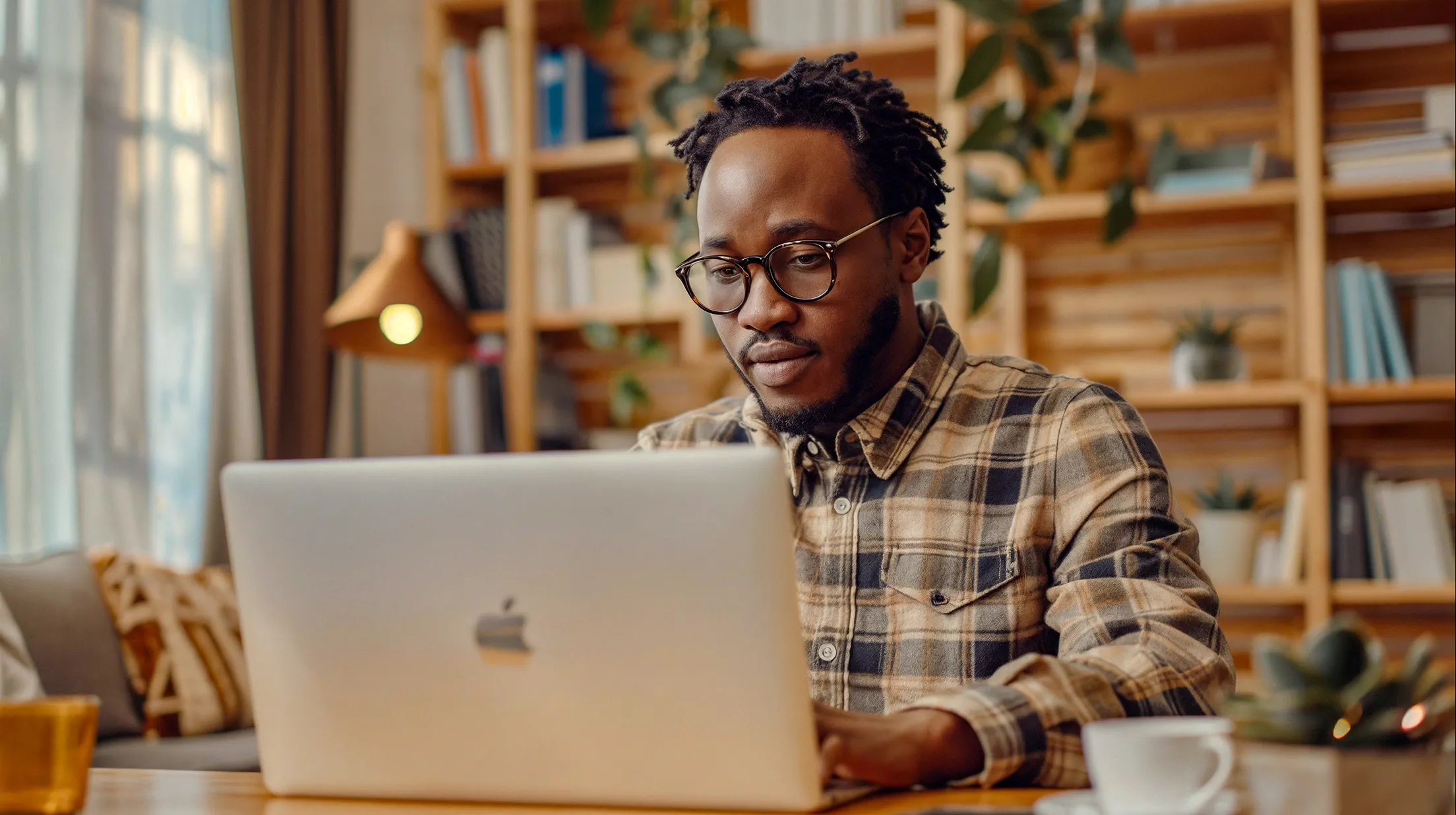Nigerian designer working on his laptop