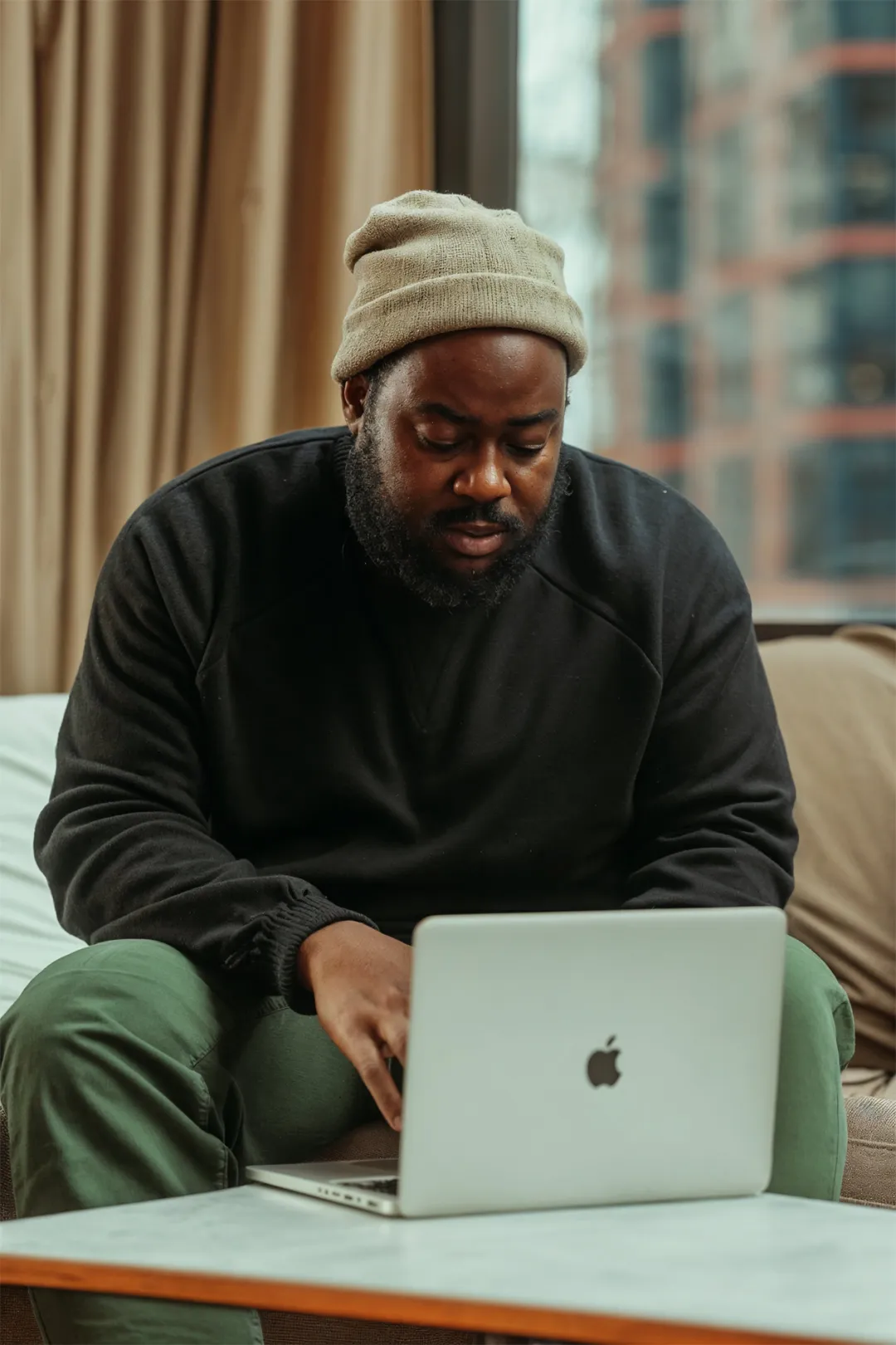 Nigerian designer working on his laptop